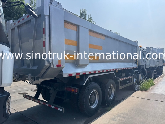 SINOTRUK HOWO 371HP 8X4 Tipper Dump Truck Construction Old Front Face Military Bumper For Mining Areas Two Warning Lights U Type Container